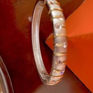 Brushed Silver tone bracelet with gold tone accents and cz’s